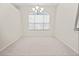 Cozy dining room featuring plush carpeting and natural light from an arched window at 4621 34Th E Ct, Bradenton, FL 34203