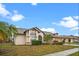 Charming home featuring a manicured lawn, mature landscaping, and a classic architectural style at 4621 34Th E Ct, Bradenton, FL 34203