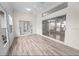 Sunroom with laminate flooring and sliding doors offering views of the exterior at 4621 34Th E Ct, Bradenton, FL 34203