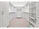 Bright walk-in closet offers ample storage with custom shelving and hanging rods at 4621 34Th E Ct, Bradenton, FL 34203