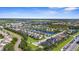 Expansive aerial view of the residential community, showcasing its serene lake and tree-lined streets at 4718 Arbor Gate Dr, Bradenton, FL 34203