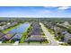 A sprawling residential community with a lake, lush greenery and meticulously kept lawns at 4718 Arbor Gate Dr, Bradenton, FL 34203