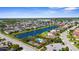 Aerial view of neighborhood amenities including a pool, playground, and pond for residents at 4718 Arbor Gate Dr, Bradenton, FL 34203
