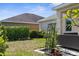 Backyard with patio furniture and lush green landscape at 4718 Arbor Gate Dr, Bradenton, FL 34203