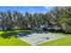 Outdoor basketball court with mature trees provides recreational space for residents at 4718 Arbor Gate Dr, Bradenton, FL 34203