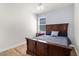 Bedroom showcasing decorative wood-frame bed with natural light from the window at 4718 Arbor Gate Dr, Bradenton, FL 34203