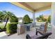 Charming front porch features comfortable seating and a serene outdoor space at 4718 Arbor Gate Dr, Bradenton, FL 34203