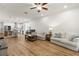 Open concept living room and kitchen with hardwood floors and lots of space at 4718 Arbor Gate Dr, Bradenton, FL 34203