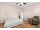 Spacious main bedroom features ceiling fan, and relaxing recliner at 4718 Arbor Gate Dr, Bradenton, FL 34203