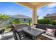 Covered patio area with outdoor furniture and landscaped garden at 4718 Arbor Gate Dr, Bradenton, FL 34203