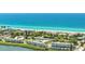 Beautiful aerial view of beachside condos and pristine blue ocean waters at 4840 Gulf Of Mexico Dr # Villa 15, Longboat Key, FL 34228