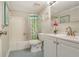 Bathroom with a tub/shower combination, white vanity and blue tiled floors at 4840 Gulf Of Mexico Dr # Villa 15, Longboat Key, FL 34228