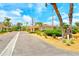 Inviting street view of charming villas with lush landscaping and ample parking at 4840 Gulf Of Mexico Dr # Villa 15, Longboat Key, FL 34228