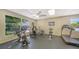 Gym with exercise equipment, including stationary bikes and treadmills, along with bright natural light at 4840 Gulf Of Mexico Dr # Villa 15, Longboat Key, FL 34228