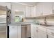 Functional kitchen with stainless steel appliances, sleek countertops, and practical layout at 4840 Gulf Of Mexico Dr # Villa 15, Longboat Key, FL 34228