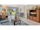 Cozy living room with tile floors, comfortable seating, and sliding glass doors to outdoor views at 4840 Gulf Of Mexico Dr # Villa 15, Longboat Key, FL 34228