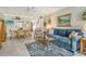 Comfortable living room with coastal decor and a dining area, creating a relaxed atmosphere at 4840 Gulf Of Mexico Dr # Villa 15, Longboat Key, FL 34228