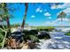 Outdoor area with grill, dining set, and waterfront views, perfect for relaxing and entertaining at 4840 Gulf Of Mexico Dr # Villa 15, Longboat Key, FL 34228