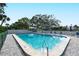 Relax in this community pool surrounded by lush landscaping and plenty of seating for residents and guests at 4840 Gulf Of Mexico Dr # Villa 15, Longboat Key, FL 34228