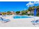 Relax by the pool with ample seating and a shaded cabana, perfect for enjoying the Florida sunshine at 4840 Gulf Of Mexico Dr # Villa 15, Longboat Key, FL 34228