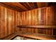 This is a sauna, featuring wooden construction, benches and a heater at 4840 Gulf Of Mexico Dr # Villa 15, Longboat Key, FL 34228