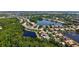 Beautiful aerial view of the community and nearby lake at 4920 Woodhurst Dr, Sarasota, FL 34243