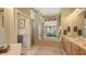 Well-lit bathroom featuring a separate shower, a soaking tub, and dual sinks at 4920 Woodhurst Dr, Sarasota, FL 34243