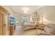 Charming bedroom features a four-poster bed, soft lighting, and private access to the outdoors at 4920 Woodhurst Dr, Sarasota, FL 34243