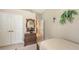 Relaxing bedroom featuring a mirror, dresser, double closet and natural light at 4920 Woodhurst Dr, Sarasota, FL 34243