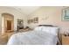 Bright bedroom with walk-in closet, desk area, and neutral color palette at 4920 Woodhurst Dr, Sarasota, FL 34243