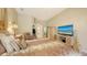 Relaxing bedroom with patterned bedding, soft lighting, TV and access to closet and bathroom at 4920 Woodhurst Dr, Sarasota, FL 34243