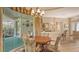 Well lit dining space with easy access to the kitchen and outside living space at 4920 Woodhurst Dr, Sarasota, FL 34243