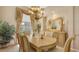 An inviting dining room with classic chandelier, complementing the table set for elegant meals at 4920 Woodhurst Dr, Sarasota, FL 34243