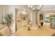 Inviting dining room with light-colored furnishings, elegant decor, and an open view to other living areas at 4920 Woodhurst Dr, Sarasota, FL 34243