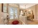 Elegant entryway featuring decorative glass double doors that lead into a dining room area at 4920 Woodhurst Dr, Sarasota, FL 34243