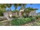 Lovely single-Gathering home featuring mature landscaping, well maintained lawn, and a two-car garage at 4920 Woodhurst Dr, Sarasota, FL 34243