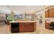 Open kitchen with a large island and bar for seating at 4920 Woodhurst Dr, Sarasota, FL 34243