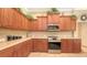 A view of the Kitchen including stainless steel appliances and plenty of cabinet space for storage at 4920 Woodhurst Dr, Sarasota, FL 34243
