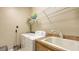 Functional laundry room with washer, dryer, utility sink, and ample storage space at 4920 Woodhurst Dr, Sarasota, FL 34243