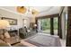Relaxing living room featuring large windows and access to the backyard at 4920 Woodhurst Dr, Sarasota, FL 34243