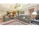 Open-concept living room that offers access to the kitchen and views of the backyard at 4920 Woodhurst Dr, Sarasota, FL 34243