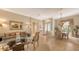 Open-concept living area flowing into dining space, highlighted by natural light and neutral decor at 4920 Woodhurst Dr, Sarasota, FL 34243