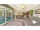 Inviting living room with access to the outdoor patio and views of the well manicured yard at 4920 Woodhurst Dr, Sarasota, FL 34243