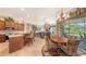 Open-concept living space with a kitchen bar and breakfast nook at 4920 Woodhurst Dr, Sarasota, FL 34243