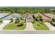Aerial view of the home with a well-maintained lawn and beautiful neighborhood surroundings at 5035 Tobermory Way, Bradenton, FL 34211