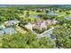 High angle shot showcasing a golf course, tennis court, pool, and parking lot at 5035 Tobermory Way, Bradenton, FL 34211