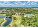 Beautiful aerial view featuring a golf course, lake, and green landscape at 5035 Tobermory Way, Bradenton, FL 34211