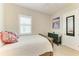 Comfortable bedroom featuring warm tones, plantation shutters, and a ceiling fan at 5035 Tobermory Way, Bradenton, FL 34211