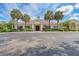 Attractive clubhouse with palm trees provides residents with a stunning gathering space at 5035 Tobermory Way, Bradenton, FL 34211