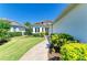 Charming single-story home featuring beautiful landscaping and a lovely paved walkway at 5035 Tobermory Way, Bradenton, FL 34211
